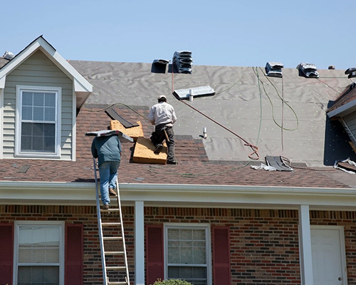 professional roofers working on a roofing repair